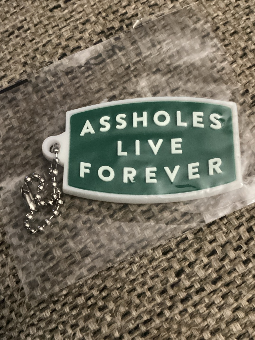 Green Novelty Keychain Tag - 'Assholes Live Forever'